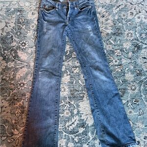 Classic Blue Women's Jeans. Low rise lightly ripped flared jeans